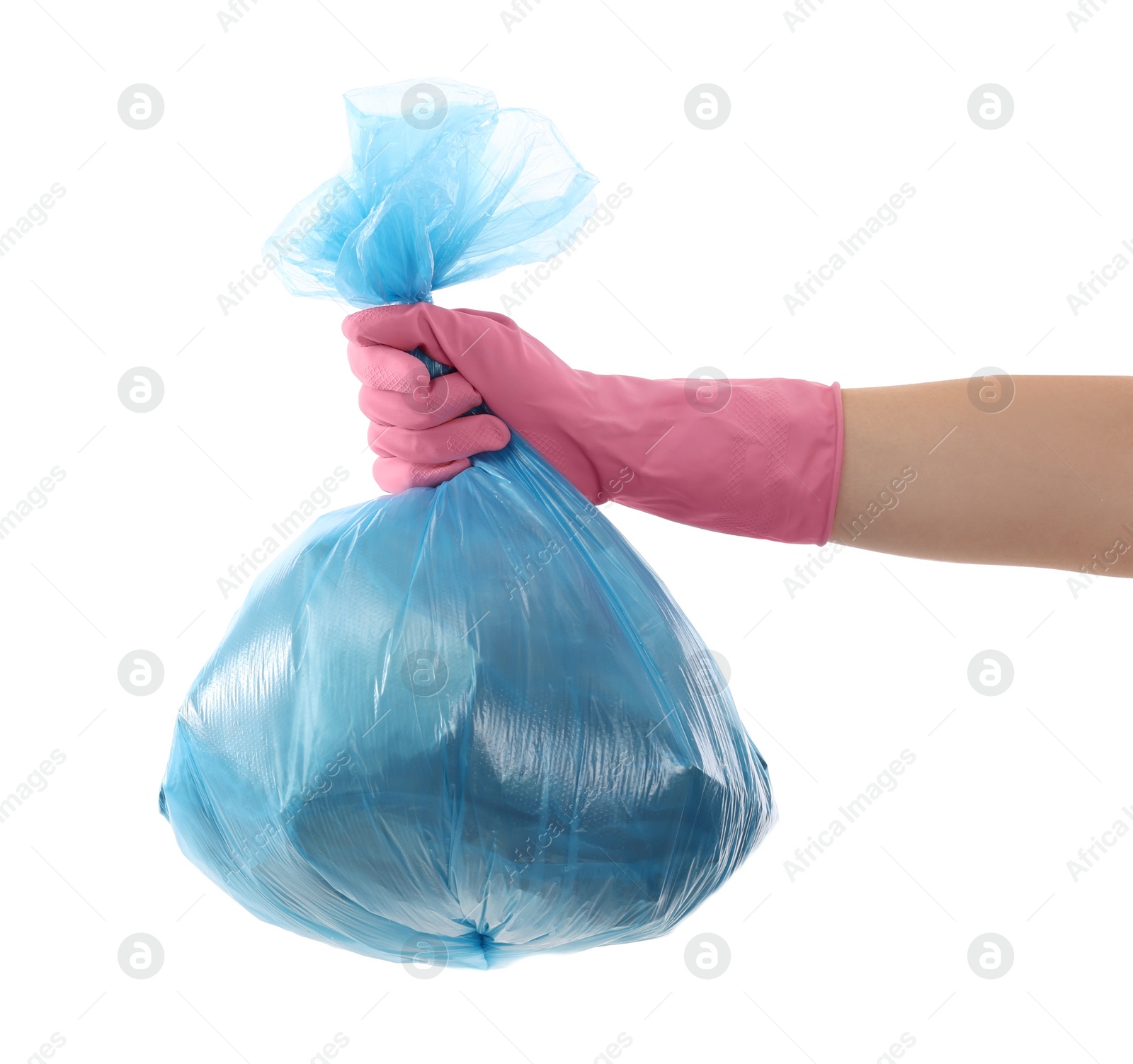 Photo of Woman holding plastic bag full of garbage on white background, closeup