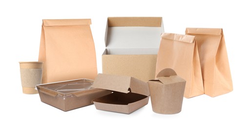 Image of Set with different paper bags and containers for food on white background