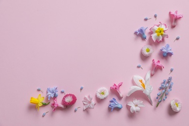 Photo of Flat lay composition with hyacinth and other spring flowers on color background, space for text