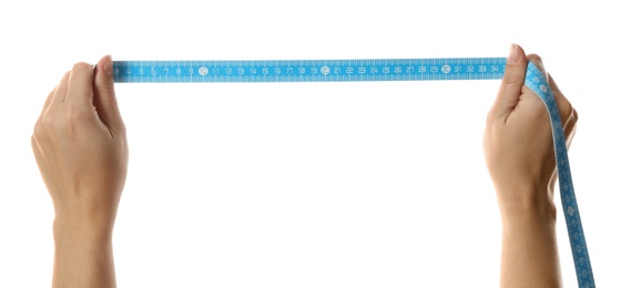 Photo of Woman holding light blue measuring tape on white background, closeup