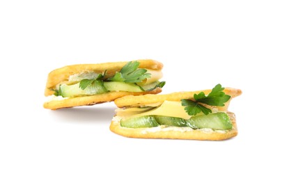 Photo of Delicious crackers with cream cheese, cucumber and parsley on white background