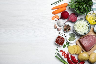Photo of Fresh borscht ingredients on white wooden table, flat lay. Space for text
