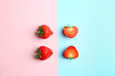 Photo of Flat lay composition with with tasty ripe strawberries on color background