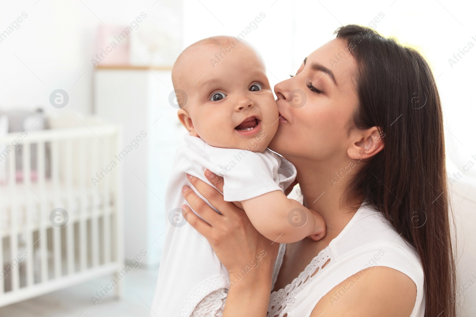 Young mother with her cute baby girl at home Photo of Young mother with her cute baby girl at home
