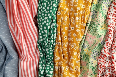Photo of Different clothes as background, closeup. Diversity concept