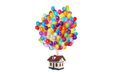 Image of Many balloons tied to model of house flying on white background