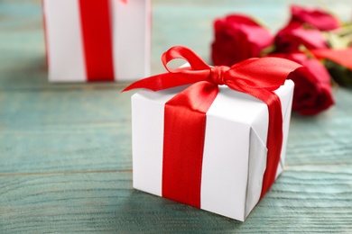 Photo of Gift box on wooden table, closeup. Valentine's Day celebration