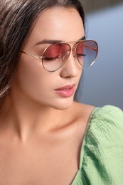 Photo of Beautiful woman in sunglasses outdoors on sunny day