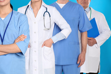 Photo of Group of doctors on blue background, closeup view