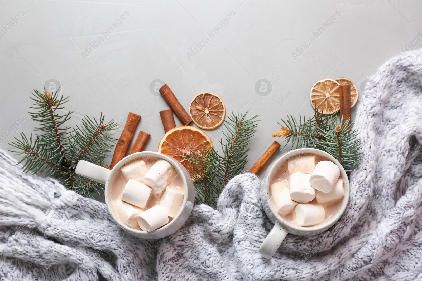 Photo of Flat lay composition with hot cocoa drink on grey background