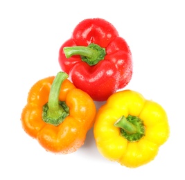 Wet ripe bell peppers on white background, top view