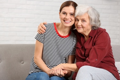 Photo of Elderly woman with female caregiver at home