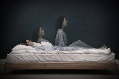 Somnambulist rising from bed near dark wall indoors, multiple exposure. Sleepwalking