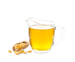 Photo of Jug with fresh corn oil and kernels on white background