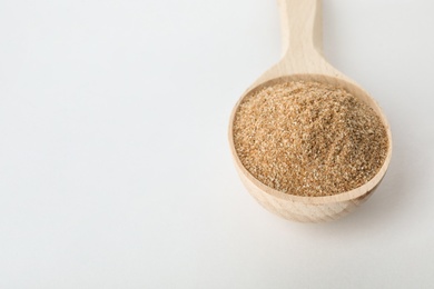 Spoon of buckwheat flour isolated on white. Space for text