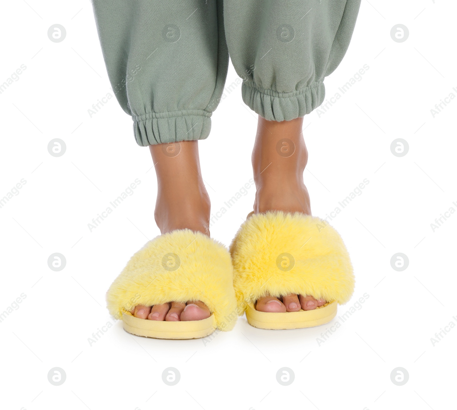 Photo of Woman in fluffy slippers on white background, closeup