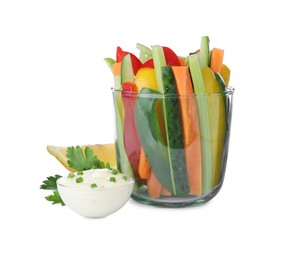 Photo of Different vegetables cut in sticks and bowl with dip sauce on white background
