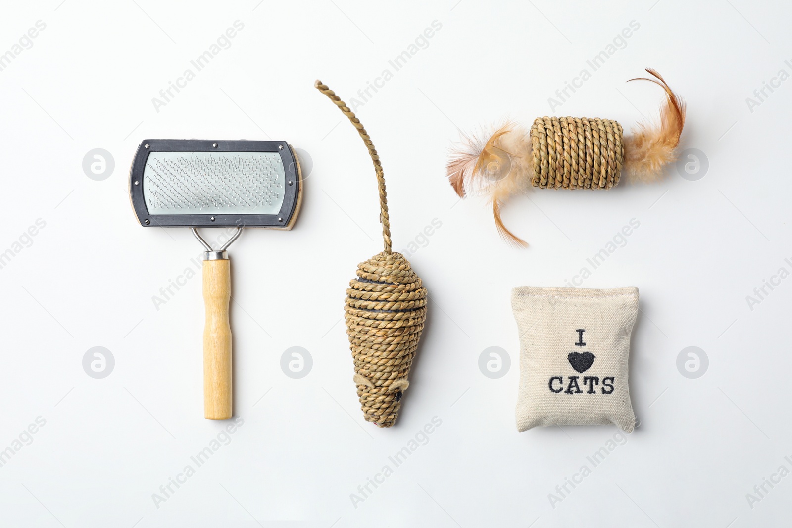 Photo of Flat lay composition with accessories for cat on white background. Pet care