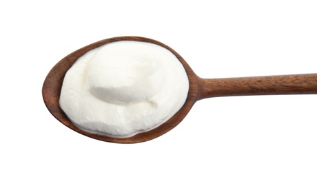 Photo of Wooden spoon with sour cream on white background, top view