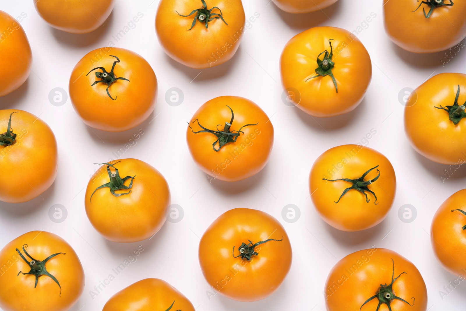 Photo of Fresh ripe yellow tomatoes on white background, top view