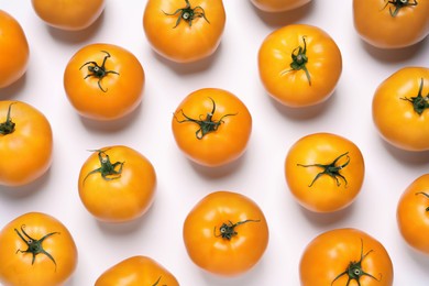 Photo of Fresh ripe yellow tomatoes on white background, top view