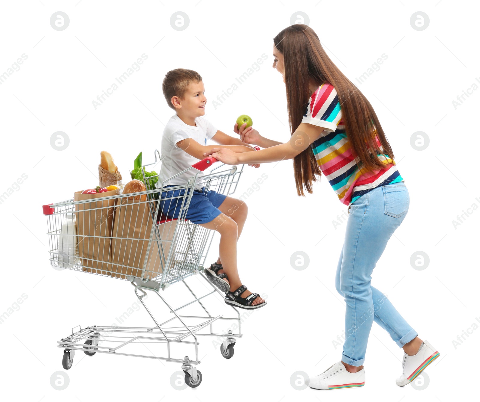 Photo of Mother and son with full shopping cart on white background