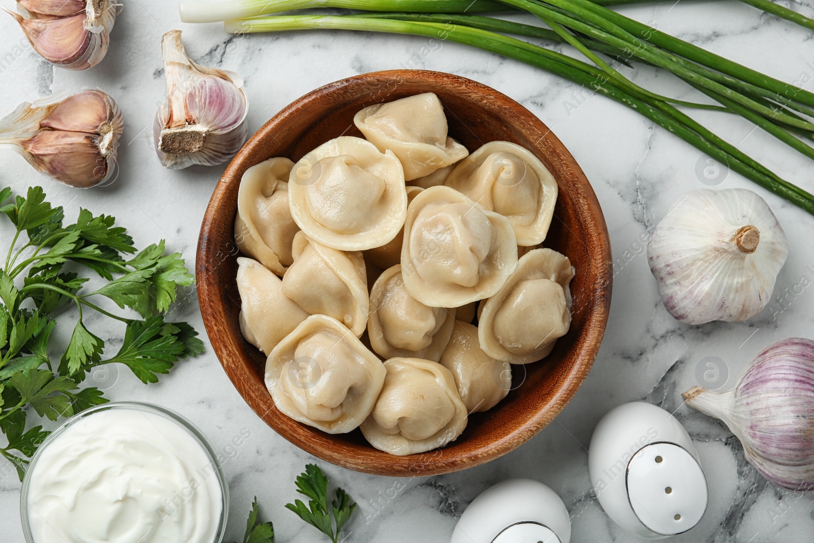 Photo of Flat lay composition with tasty dumplings on marble table