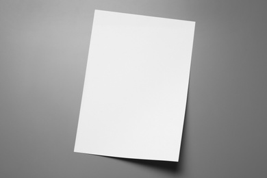 Photo of Blank paper sheets for brochure on grey background, top view. Mock up