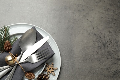 Photo of Beautiful Christmas table setting on grey background, top view. Space for text