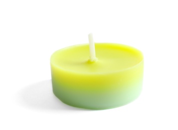 Photo of New small wax candle on white background