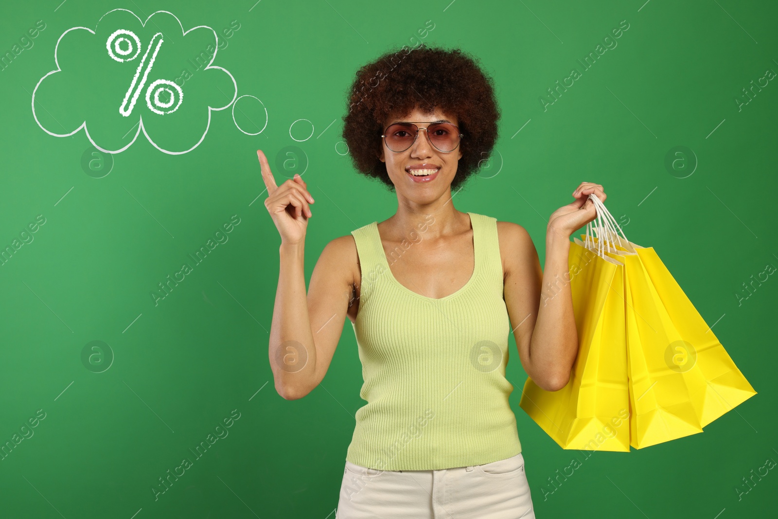 Image of Happy woman with shopping bags implying discount offer on green background. Thought bubble with percent sign near her