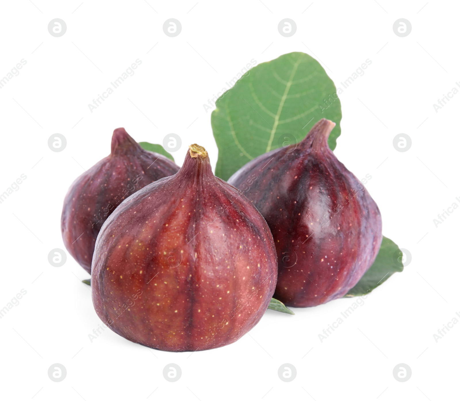 Photo of Fresh juicy purple figs and green leaves on white background