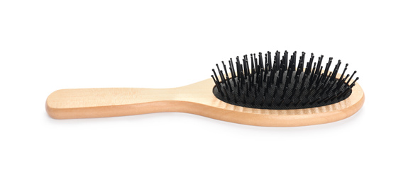 Photo of New wooden hair brush isolated on white