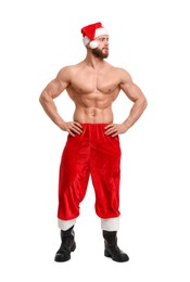 Photo of Attractive young man with muscular body in Santa hat on white background