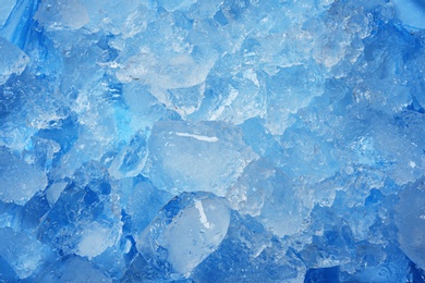 Photo of Crushed ice on color background, top view