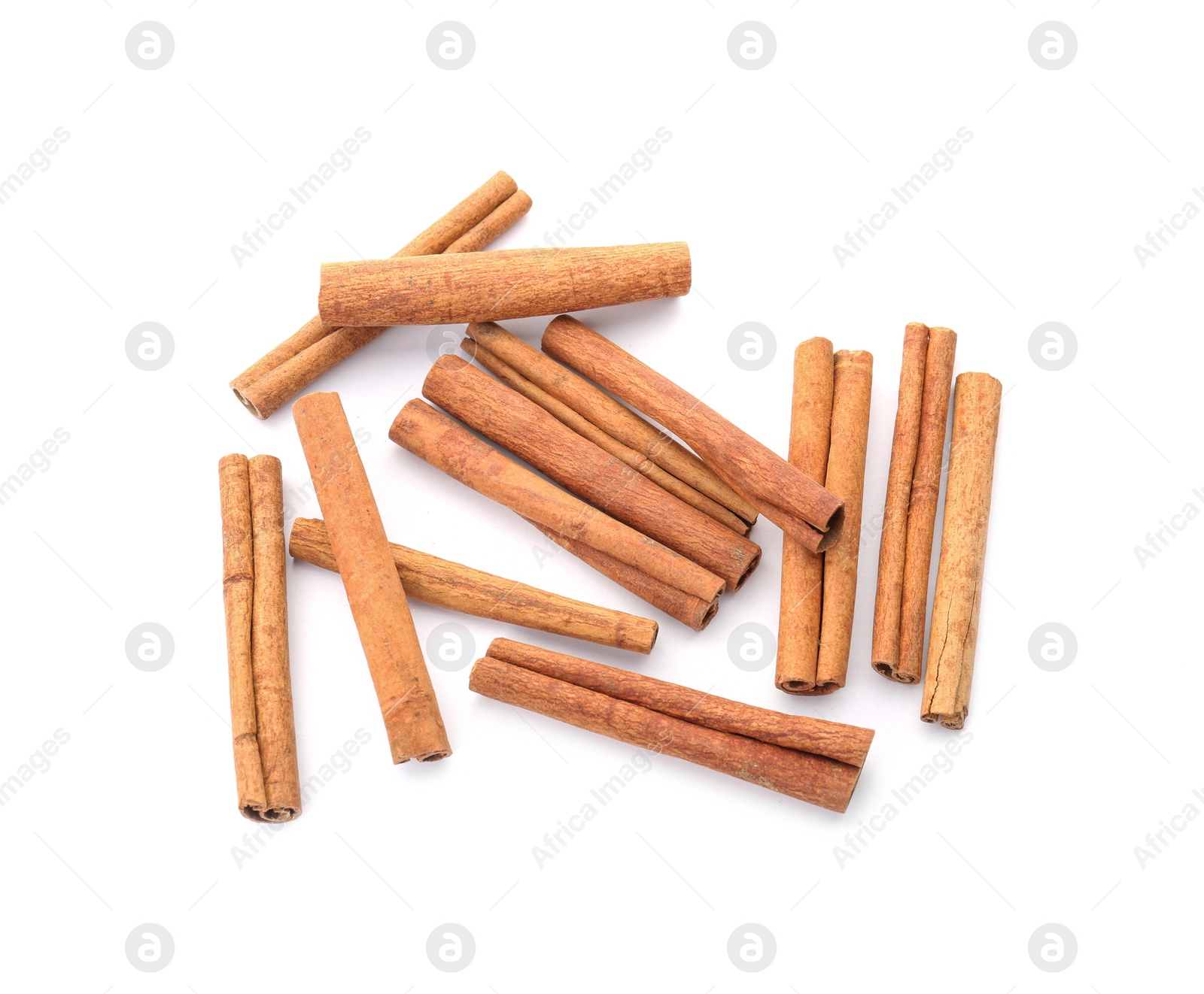 Photo of Aromatic cinnamon sticks on white background