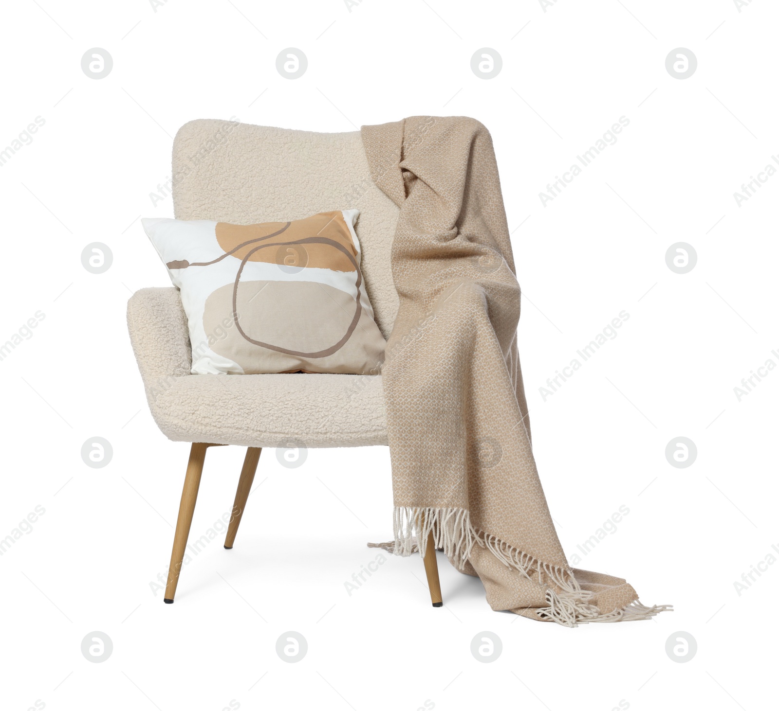 Photo of One stylish comfortable armchair with blanket and pillow isolated on white