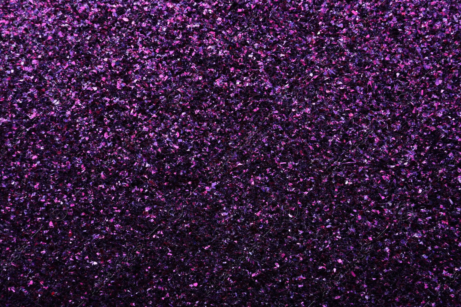 Photo of Beautiful shiny purple glitter as background, closeup