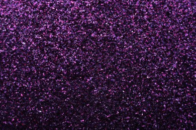 Beautiful shiny purple glitter as background, closeup