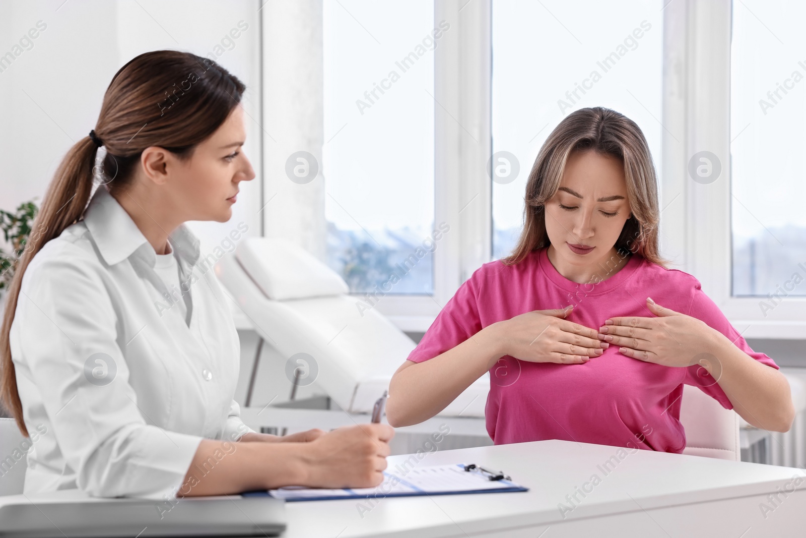 Photo of Mammologist consulting woman during appointment in hospital