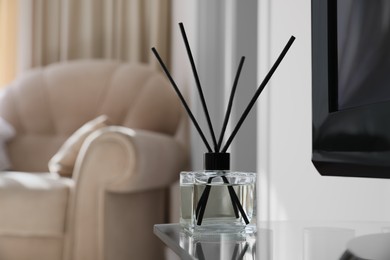 Aromatic reed air freshener on tv table indoors