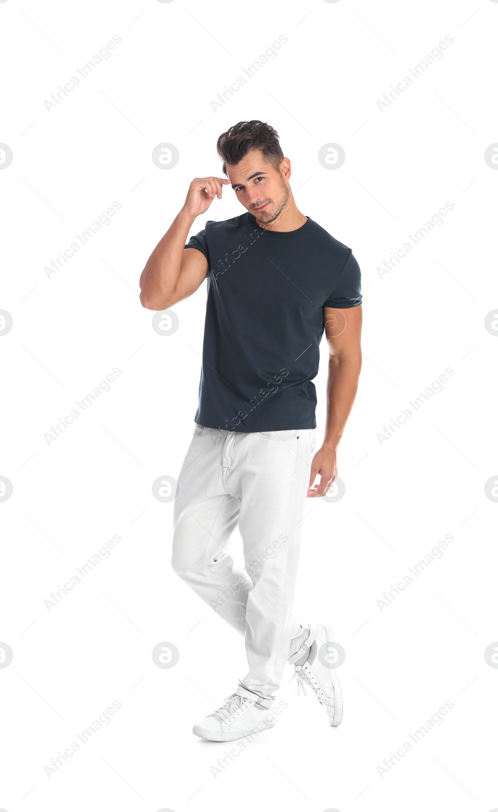 Photo of Young man in stylish jeans on white background