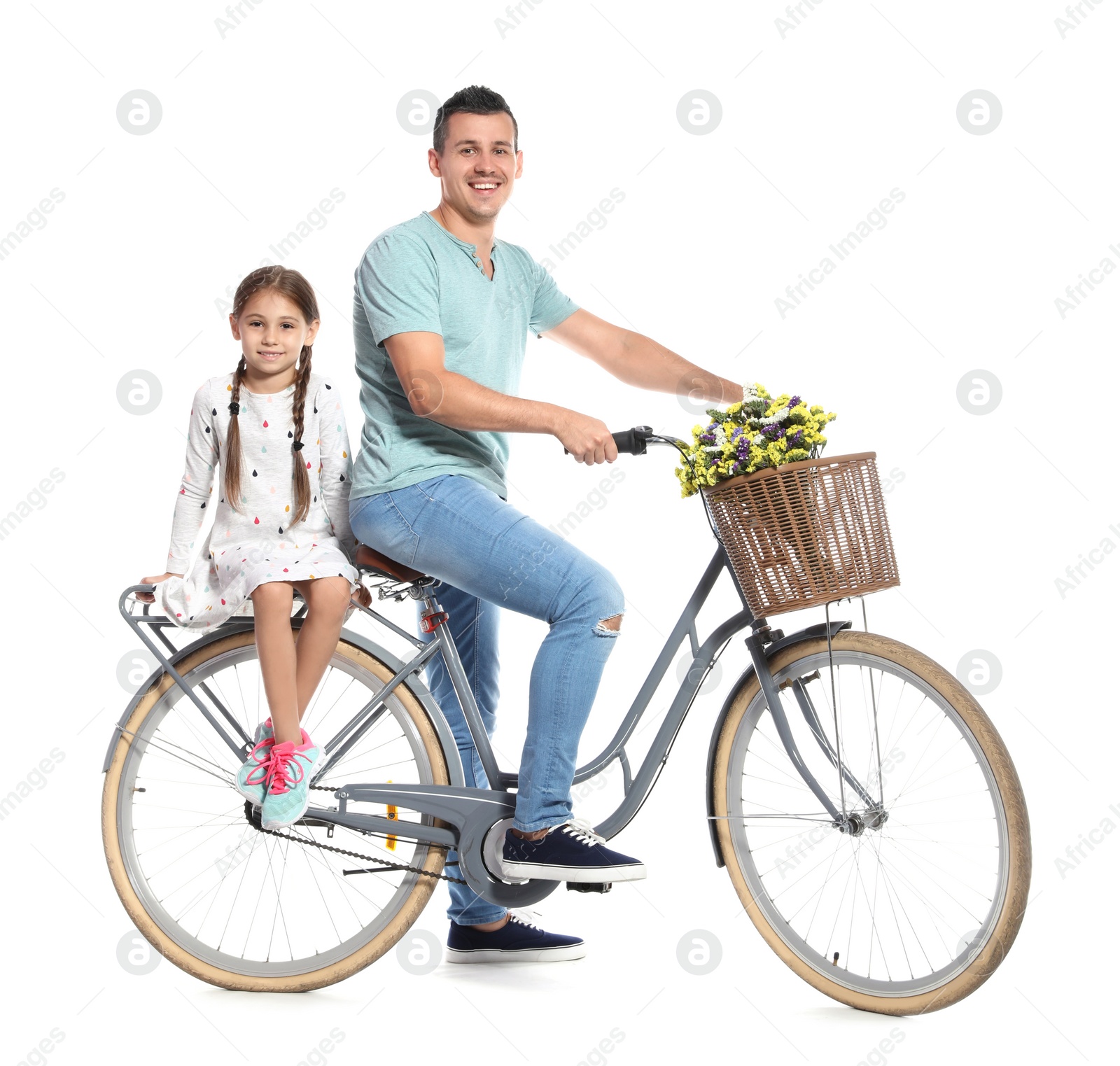 Photo of Portrait of father and his daughter with bicycle on white background