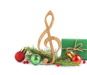 Photo of Treble clef with decorations isolated on white. Christmas music concept