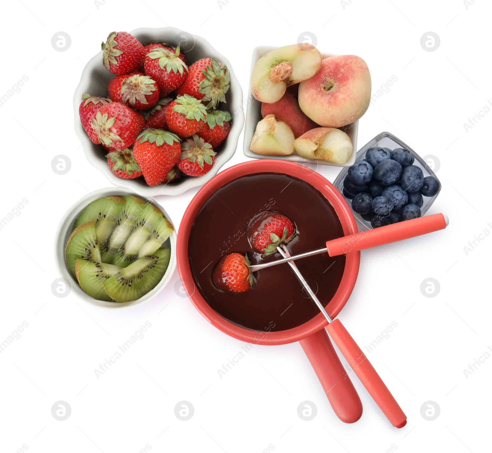 Photo of Fondue pot with chocolate and mix of fruits on white background, top view