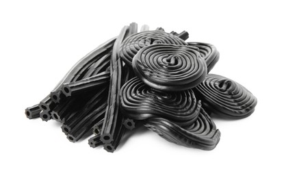 Pile of tasty liquorice candies on white background