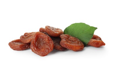 Photo of Tasty dried apricots and leaf on white background