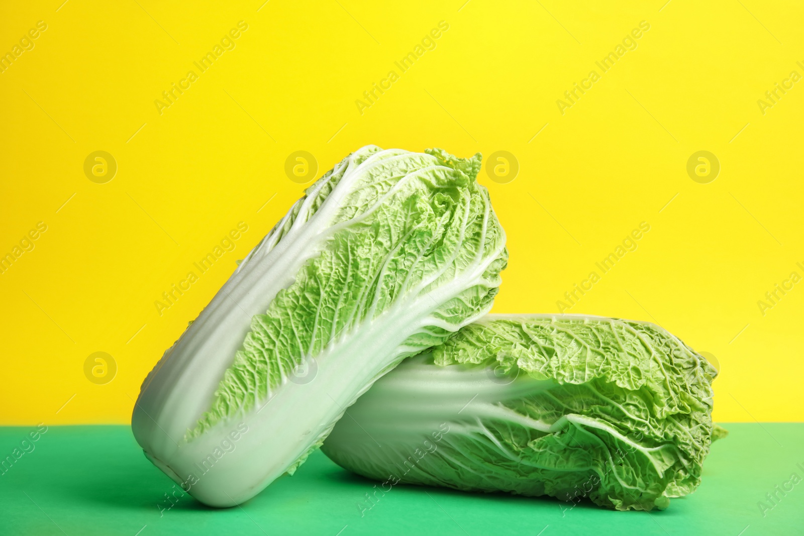 Photo of Fresh ripe cabbages on color background