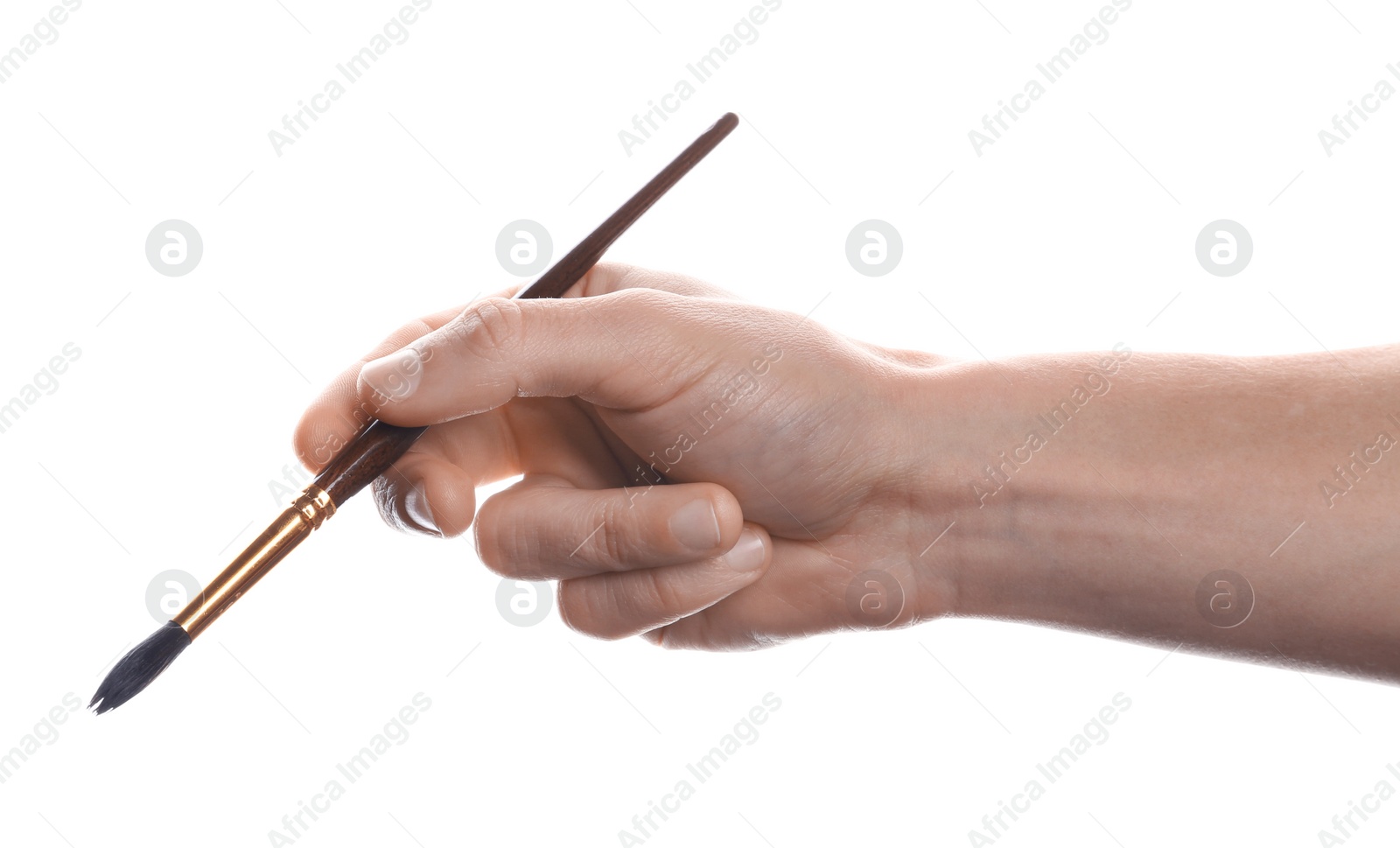 Photo of Man holding paint brush on white background, closeup