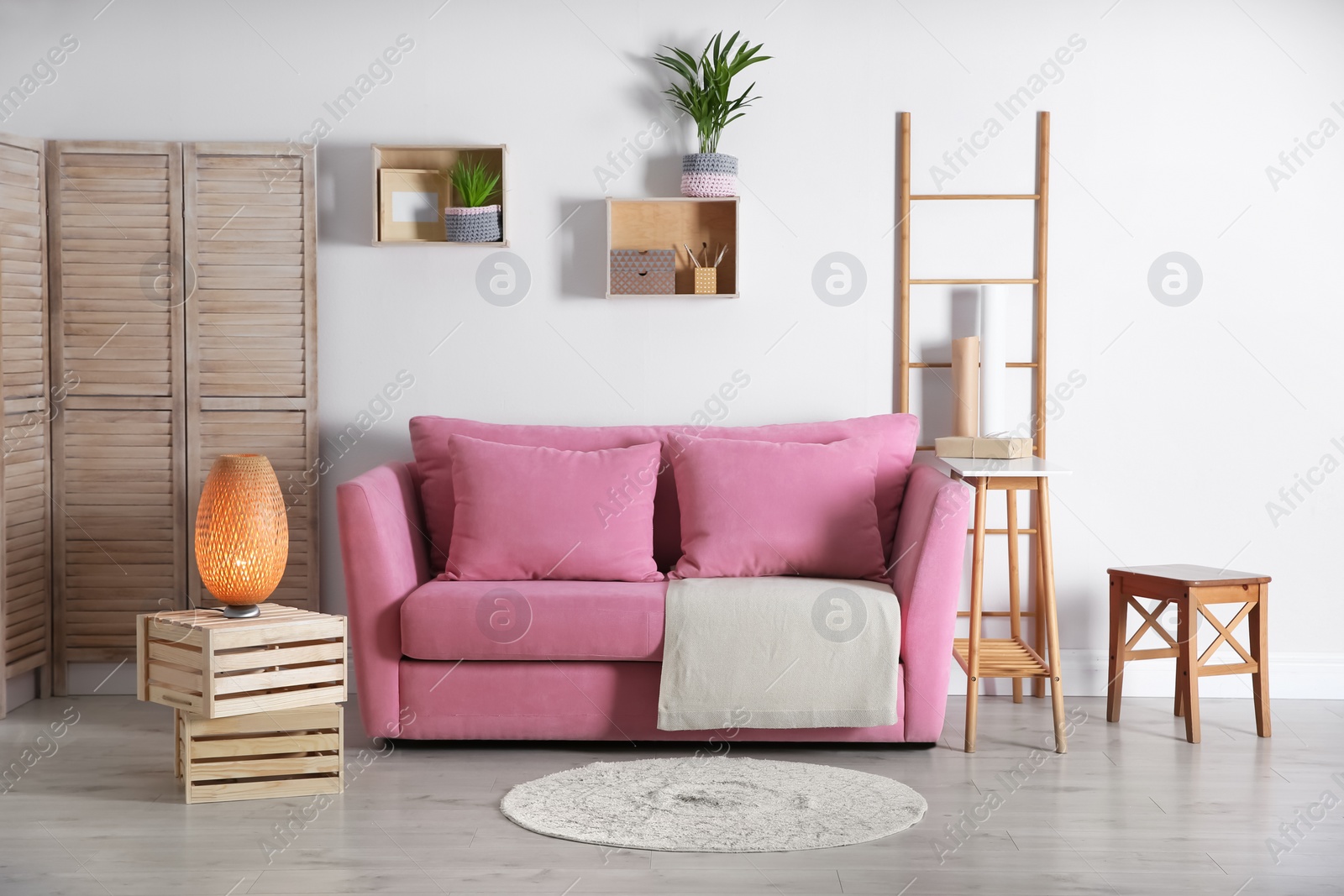 Photo of Modern living room interior with stylish pink sofa